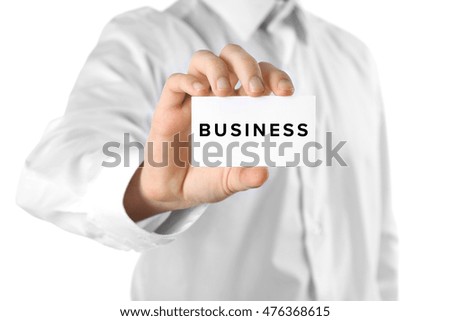 Business trainer with business card, close-up