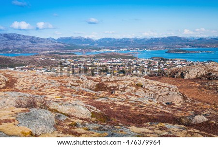 Northern Norway in springtime. Mountain landscape with red moss growing on rocks