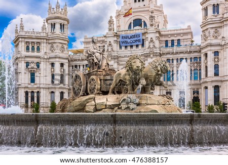 Cybele's fountain on Cybele's Square (Plaza de la Cibeles) and Central Post Office (Palacio de Comunicaciones) in Madrid, Spain