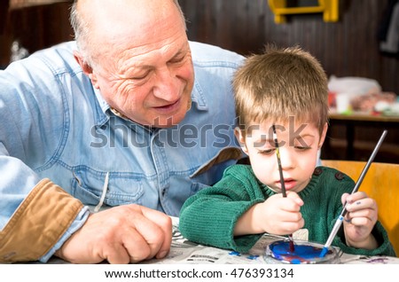 Grandson and grandfather painting