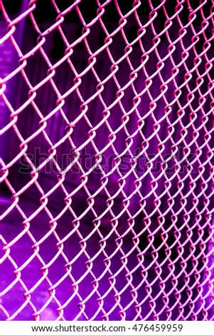 violet grid on dark background, violet pink netting against dark back, netting grid as texture, high quality resolution