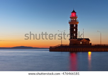 Baikal Lake. Turka. Lighthouse at Baikal Harbour at sunset