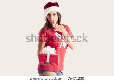 Holidays, sale, christmas and shopping concept - woman holding a gift