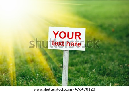 your text here banner on green grass background, yellow sunshine