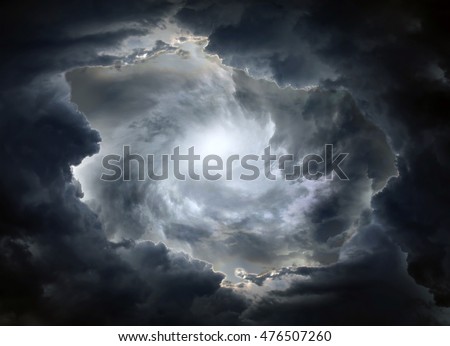 Light in the Dark and Dramatic Storm Clouds Royalty-Free Stock Photo #476507260