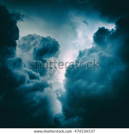 Toned Photo of the Light in the Dark and Dramatic Storm Clouds