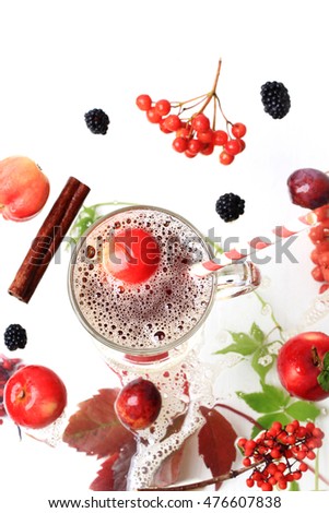 apple juice autumn hot drink on a white wooden background top view blackberry cinnamon fall leaves rowan