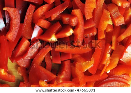 Small cut red sweet pepper  on  board