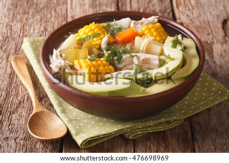 Colombian cuisine: ajiaco soup with chicken and vegetables close up in a bowl on the table. horizontal
 Royalty-Free Stock Photo #476698969