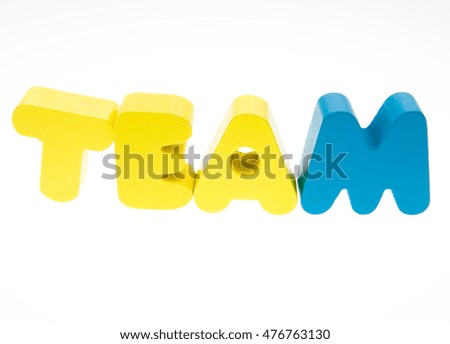 Wooden letters spelling the word  "teamwork"  on white background. 