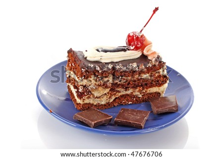 Chocolate cake with  cream and cherry