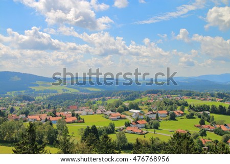The picture was taken in Germany, near the town of Grafenau. In the picture visible cloud landscape Bavarian valleys and hills covered with forests.