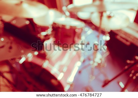 Abstract blur drum set in retro restaurant music stage for background usage . (vintage tone)