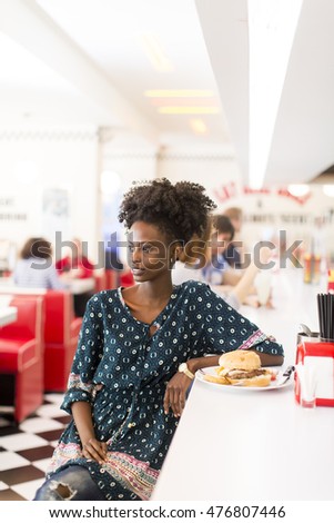 Young african american woman in the diner