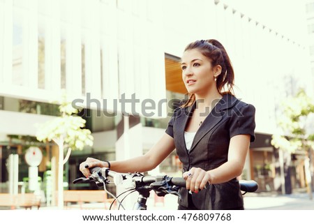 Young woman commuting on bicycle