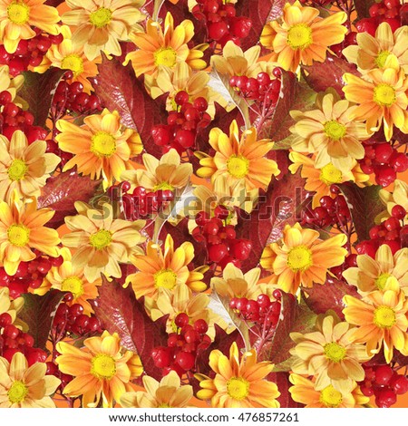 Beautiful autumn background from the berries viburnum and yellow chrysanthemum 