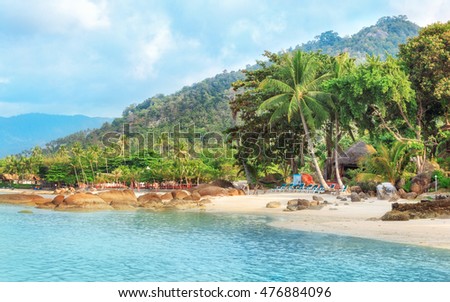 Empty morning Samui beach with rocks on foreground Royalty-Free Stock Photo #476884096