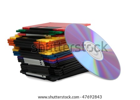 Heap of diskettes and compact disk isolated over white background