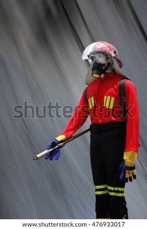 Fire fighter statue with abstract background