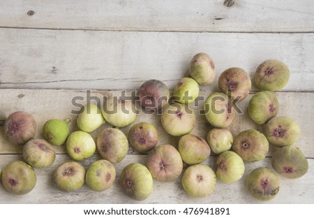 Figs on an old wooden table.