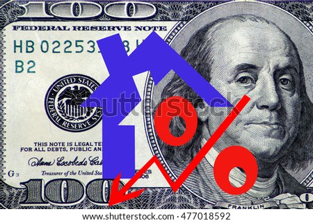 Red percent sign on a background of money . The concept of price changes on the real estate market