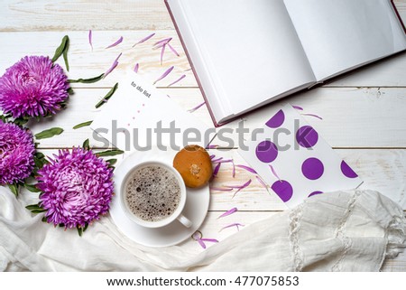 Word relax with book, cup of coffee and pink flowers. Copy space for text. greeting card