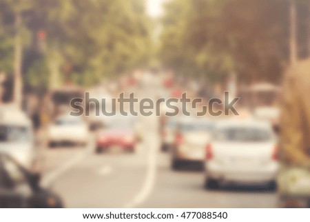 Blurred image of city traffic. Toned photo