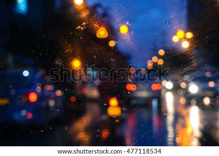 Blurred light on road during raining with twilight, natural light