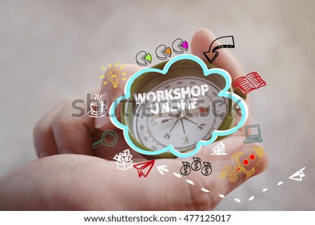 compass on hand with  WORKSHOP ONLINE text , business concept