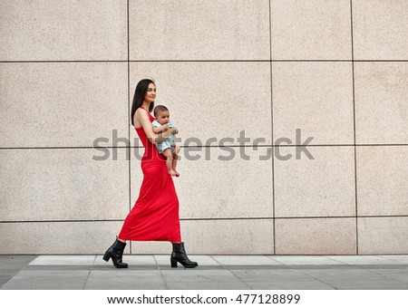 Fashionable modern mother on a city street