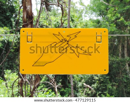 Close up image,Signs electric fence wire,Danger - Electric fence sign.         