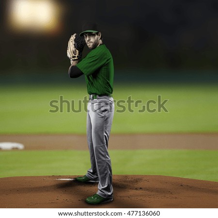 Pitcher Baseball Player with a green uniform on baseball Stadium.