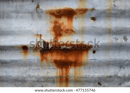 rust on silver stainless wall
