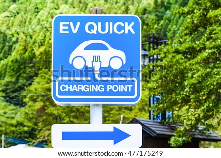 EV QUICK CHARGING POINT  Signboard.Background is a mountain.