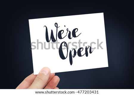 We're open written on a white card