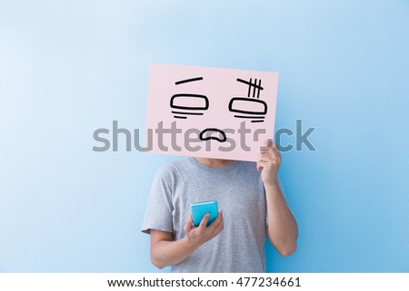 man holding confused expression billboard and take phone  isolated on blue background