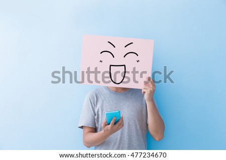 man holding happy expression billboard and take phone  isolated on blue background