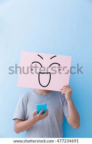 man holding happy expression billboard and take phone isolated on blue background