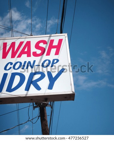 vintage laundromat and dry cleaners sign                               