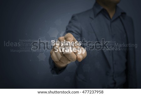 Businessman hand working with new modern computer and business strategy as concept blue tones