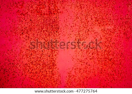 red metal plate with cracked paint and big paint spots because of time as background, metal wall with rusty spots and cracked paint as texture, toned to color, high quality resolution