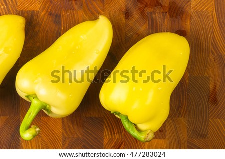 still life - yellow pepper on wooden Board