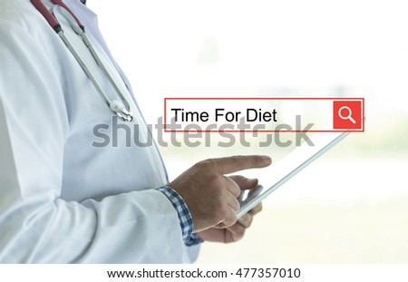 DOCTOR USING TABLET PC AND SEARCHING TIME FOR DIET ON WEB