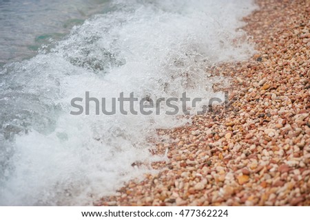 Sea wave and pebble. Natural composition
