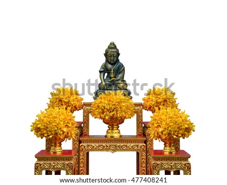 Worship Buddha with yellow flowers on the table on isolate background.
