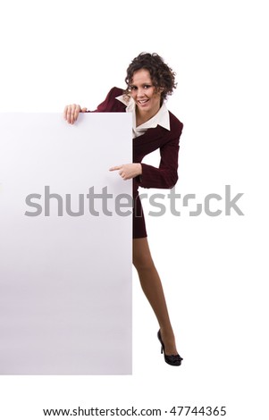 Whole-length portrait of businesswoman holding white blank card against isolated white background. A beautiful young business woman is holding a blank white sign.