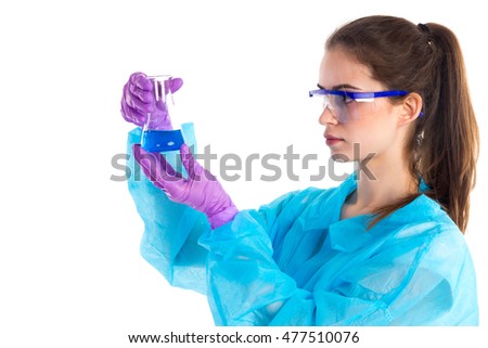 On a white background the woman with special glasses is showing a result of a mix of a tube with a navy liquid and a flask with a water.