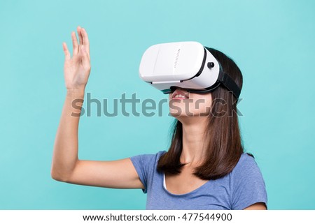 Asian Woman looking though VR device