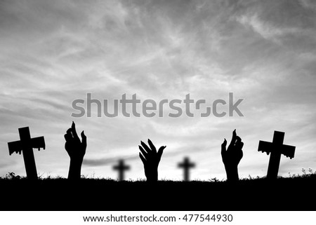Hand and cross on sunset. Concept Halloween

