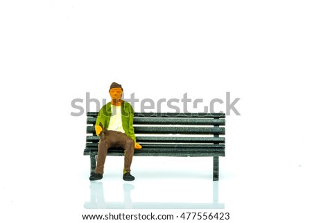 Miniature people business traveler concept sit on chair on white background with a space for text
